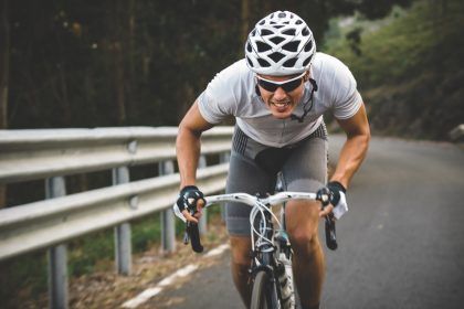 Cyclist in maximum effort Cyclist in maximum effort in a road outdoors